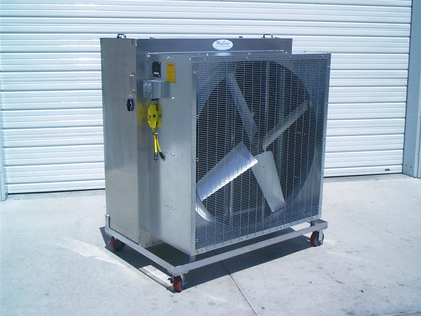 A stainless steel MegEvap HV portable cooler on casters, with a large belt-drive fan behind a wire guard
