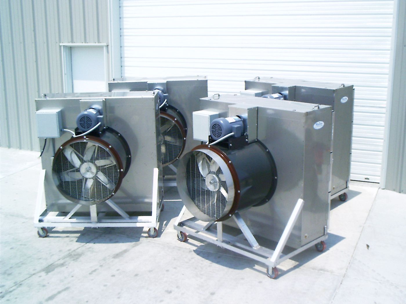 Three HVTA-30 portable evaporative coolers on wheeled frames, each with a large tube axial blower